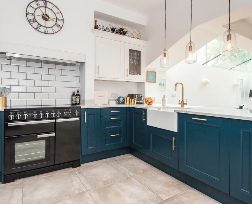 Modern blue kitchen with gold accents