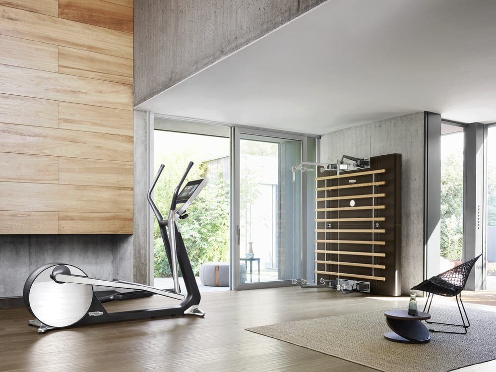 Modern gym room with technogym equipment and bars